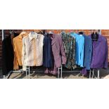 A collection of vintage lady's clothing including blouses, two piece skirt suit,