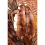 A collection of vintage lady's fur coats and an evening stole