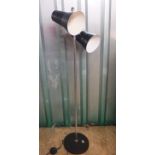 A mid Century Scandinavian black and metal floor lamp with two adjustable lights.