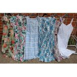 A collection of six vintage floral print summer dresses