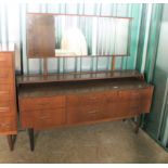 A 1970's bedroom suite including double wardrobe with central mirror,