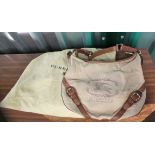 A vintage Burberry canvas and tan leather handbag with original outer bag