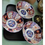 Three Imari petal edged bowls with floral and trellis panels