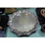 A 19th Century silver plated salver by Jays with engraved foliate decoration within a scroll and