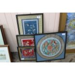 Four framed Chinese silk panels with birds and fish,