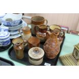 A tray of 19th Century stoneware mugs,