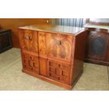 A large two door veneered mahogany cupboard