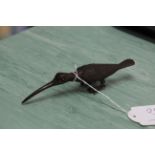 A bronze long billed bird,