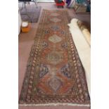 A Caucasian large handmade wool runner (worn),