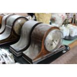 Four wooden cased chiming mantel clocks