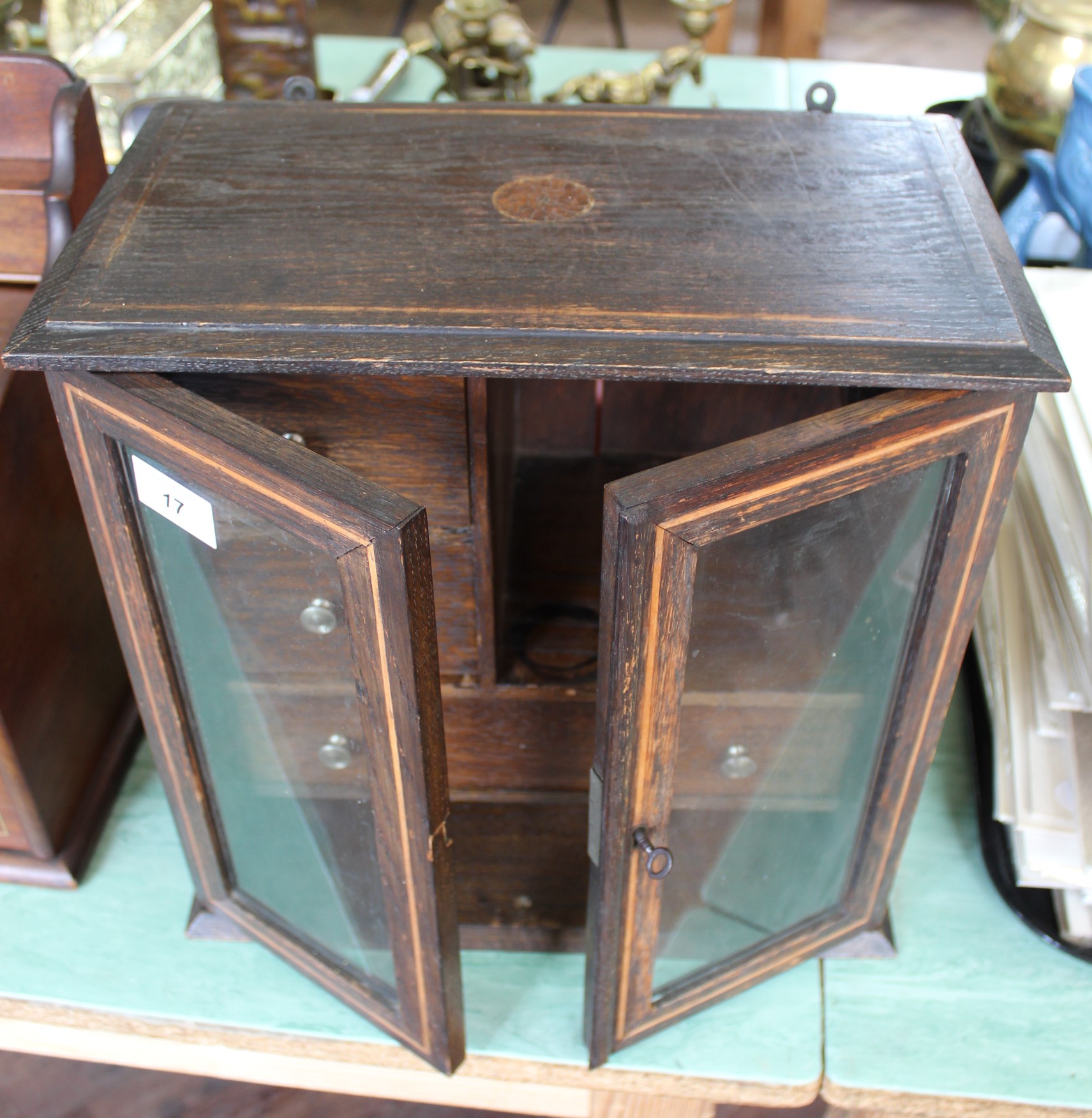 An oak three drawer smokers cabinet,