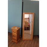 An oak framed wall mirror plus an oak three drawer chest