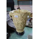A large carved alabaster lamp with elephant head handle,
