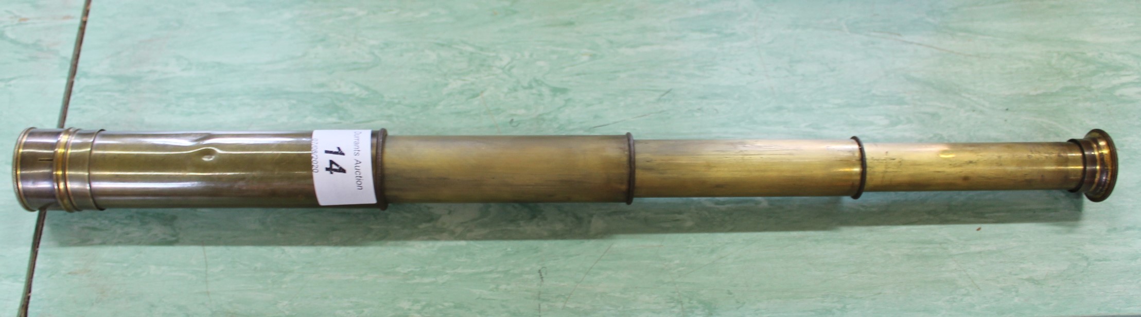 A 19th Century three drawer brass telescope with end cap
