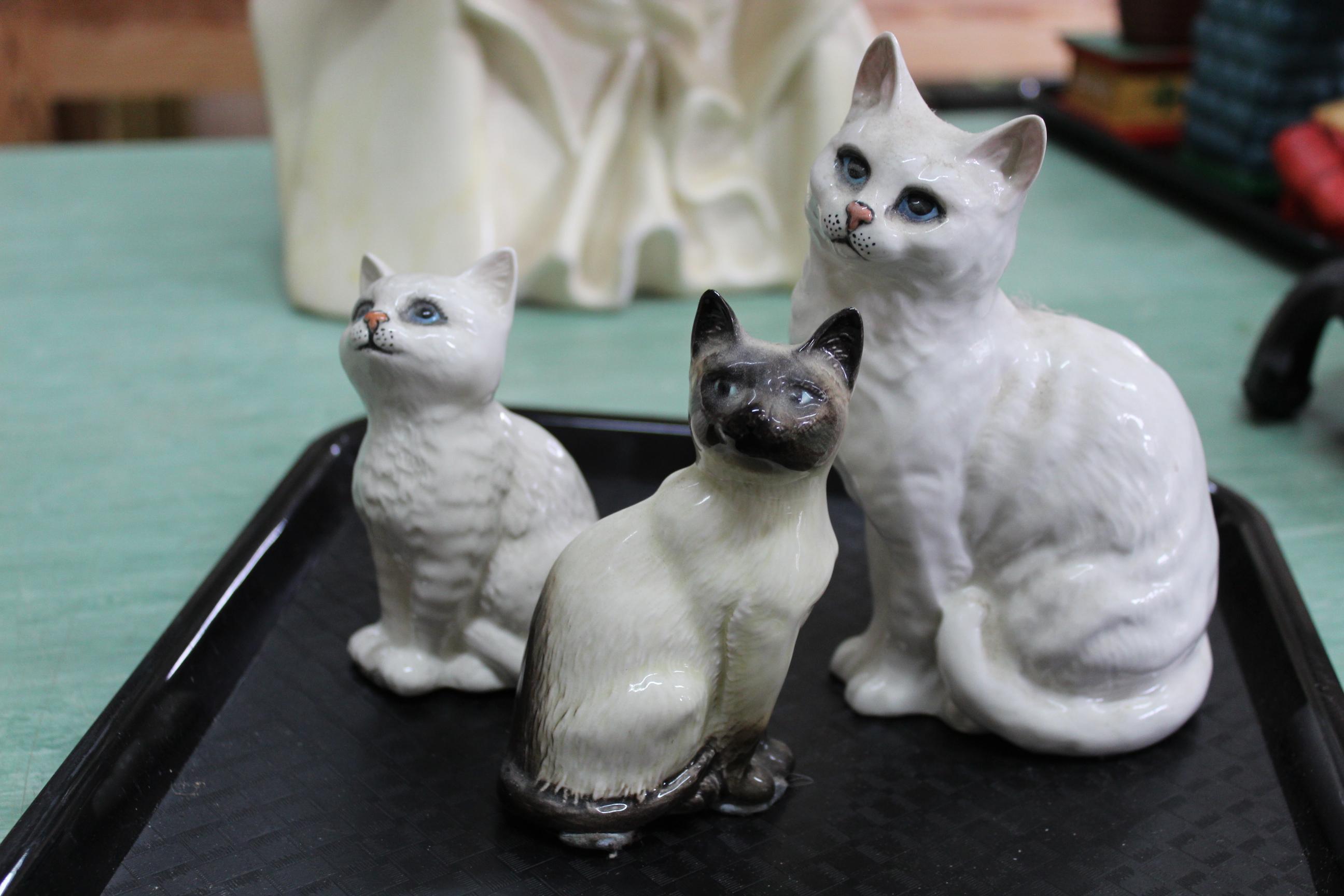 Three Beswick cat ornaments