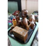 A tray of wooden items, carved Indian head, animals,