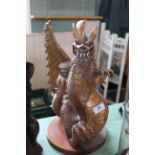 An ornate carved wood rearing dragon figure,