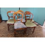 A harlequin set of five Victorian balloon back chairs