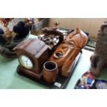 A tray with a cuckoo clock, mantel clock,