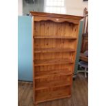 Large pine bookshelves on turned bun feet