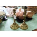 A large pair of 18th Century French seamed brass candlesticks with fluted and beaded decoration and