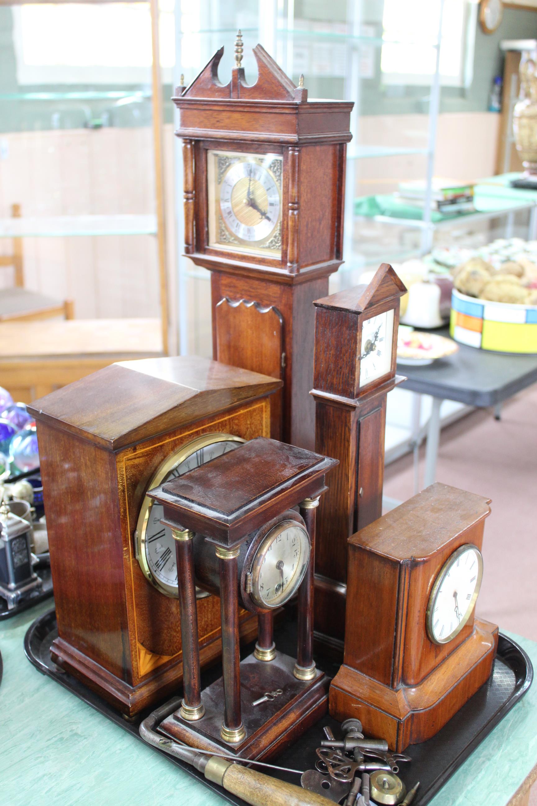 Five various wooden cased mantel clocks including a miniature long case