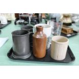 A small tray with two pewter tankards, stoneware jars,