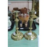 A large pair of 18th Century French seamed brass candlesticks with fluted and beaded decoration and