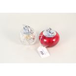 Two Ronson table lighters, one with a ruby glass base,