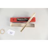 A boxed Swan gold plated self filling pen by Mabie Todd & Co.