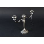 A silver three branch candelabra, hallmarked Birmingham 1976, maker's mark Sanders & MacKenzie,