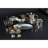 A collection of Elkington silver plate items including a toast rack, egg cups, tea set,