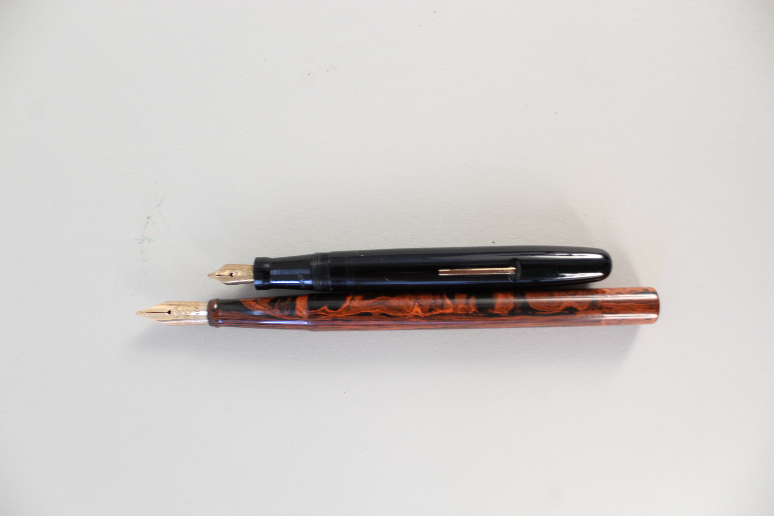 A De La Rue "Unoto" of London ink pen together with a Swan self filler with 14ct gold nibs
