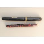 A Conway Stewart Dinky 550 ink pen together with one other marked "The Conway Stewart",