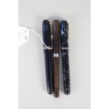 Two Swan self-filler ink pens together with Watermans USA,