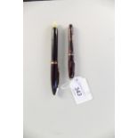 A Conway Stewart Dinkie 550 ink pen together with a Menthore Paramount pen,