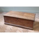An early 19th Century elm box on shallow plinth and candle box to interior