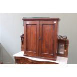 A 19th Century mahogany two door cabinet with fitted interior