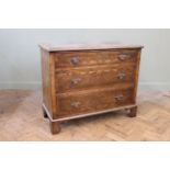 An early 20th Century Queen Anne style three drawer walnut veneered chest,