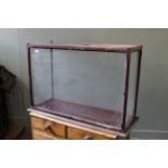 A late 19th Century glazed mahogany cabinet for a ship model,