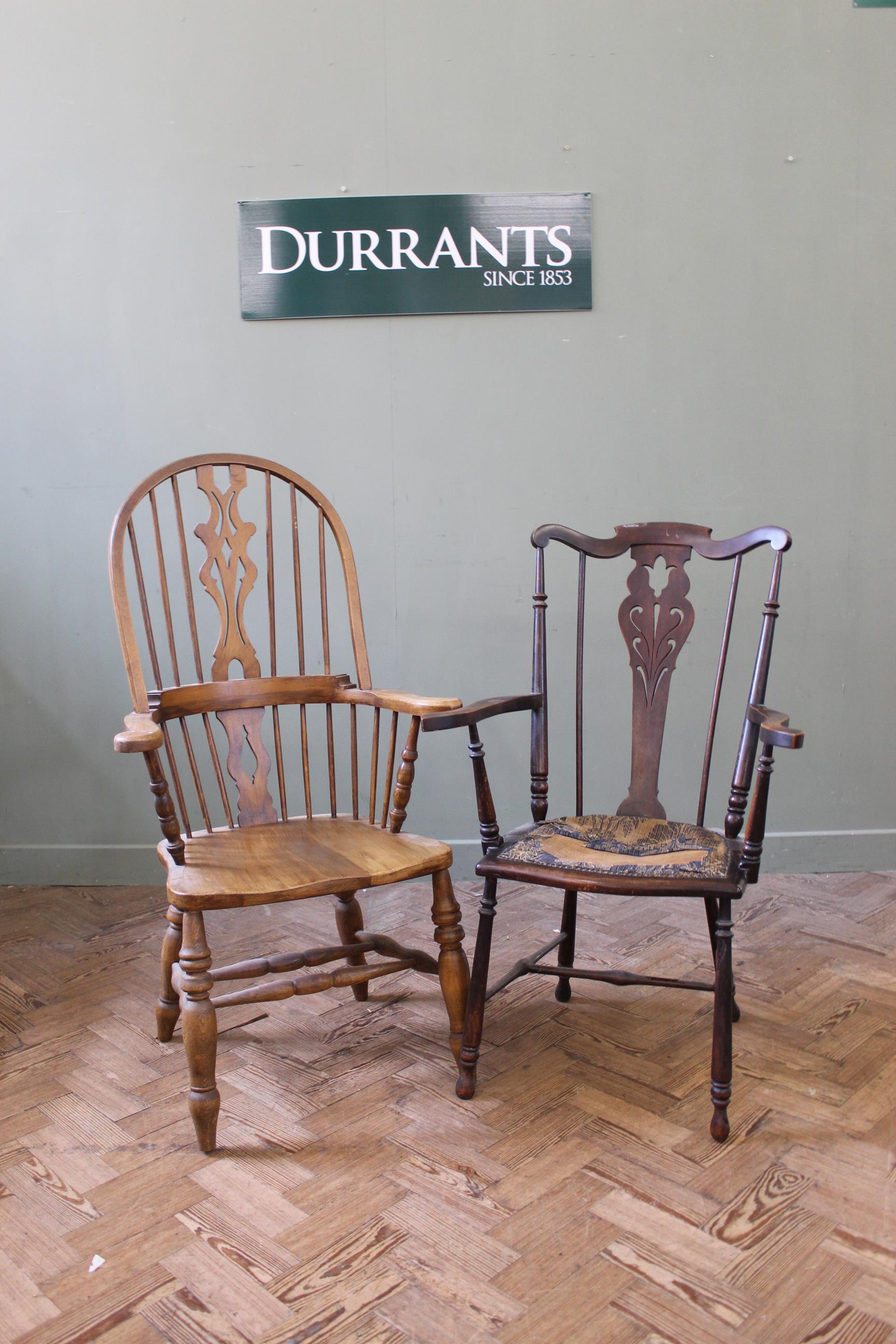 A 20th Century high back Windsor chair in beech and an Edwardian comb back Windsor chair with