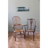 A 20th Century high back Windsor chair in beech and an Edwardian comb back Windsor chair with