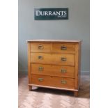 A late 19th Century walnut five drawer chest with military handles,