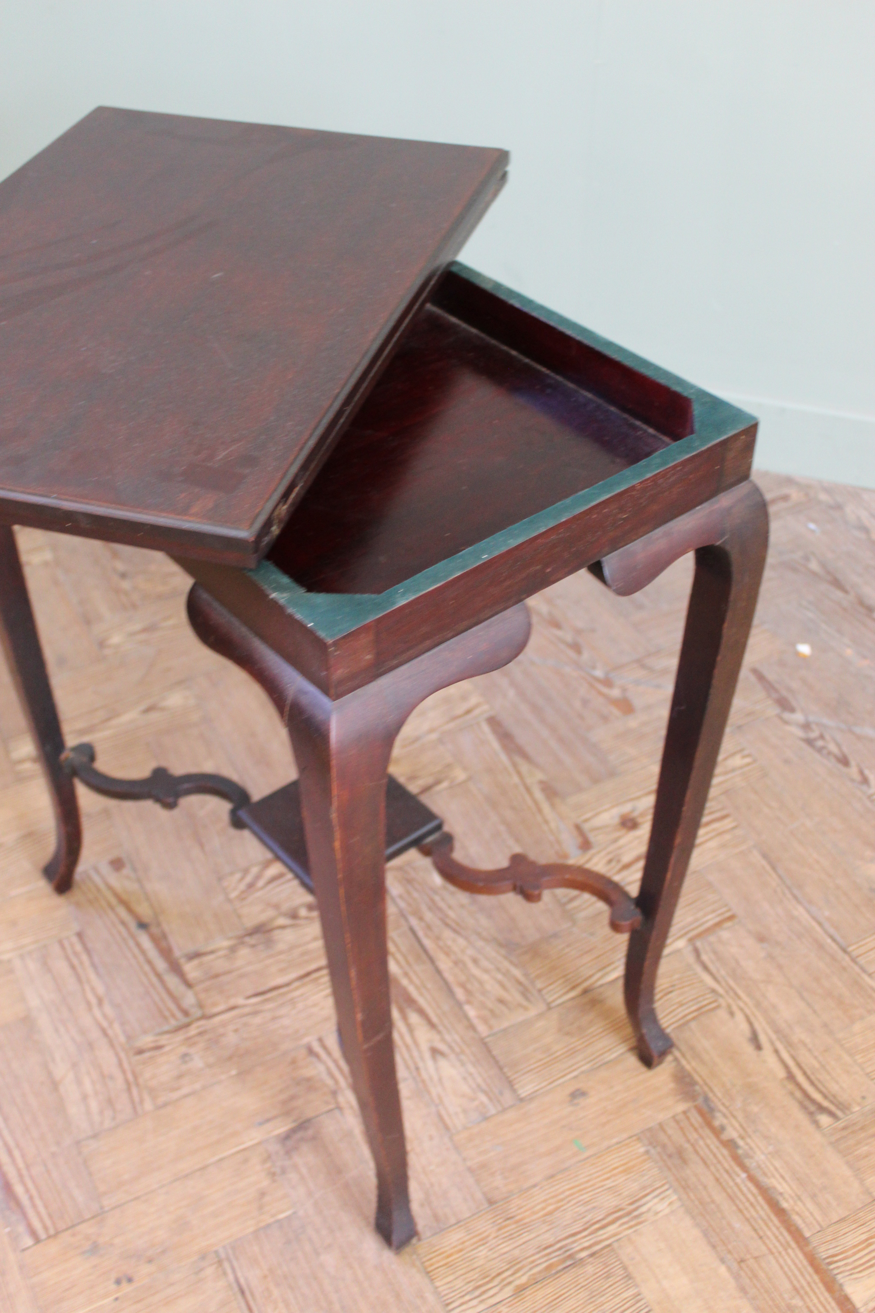 An Edwardian mahogany swivel top games table on cabriole legs and shaped under tier, - Image 3 of 3