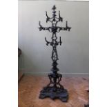An ornate cast iron coat stand