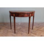 A late 18th Century mahogany demi lune tea table on square tapered legs with inlaid satinwood