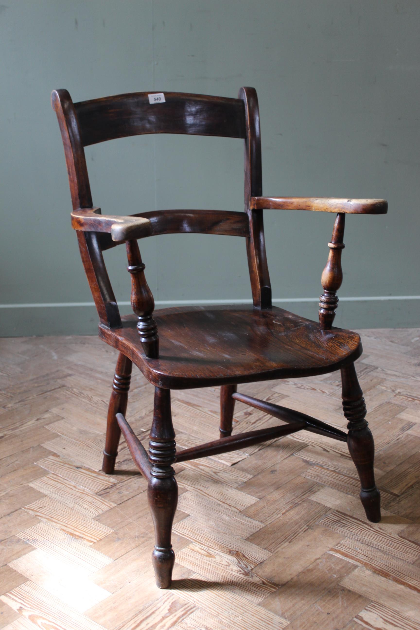 A mid 19th Century elm and beech country armchair,