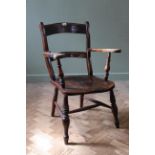 A mid 19th Century elm and beech country armchair,