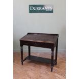 A late 19th Century stained pine slope front desk, lift up top with fitted interior,