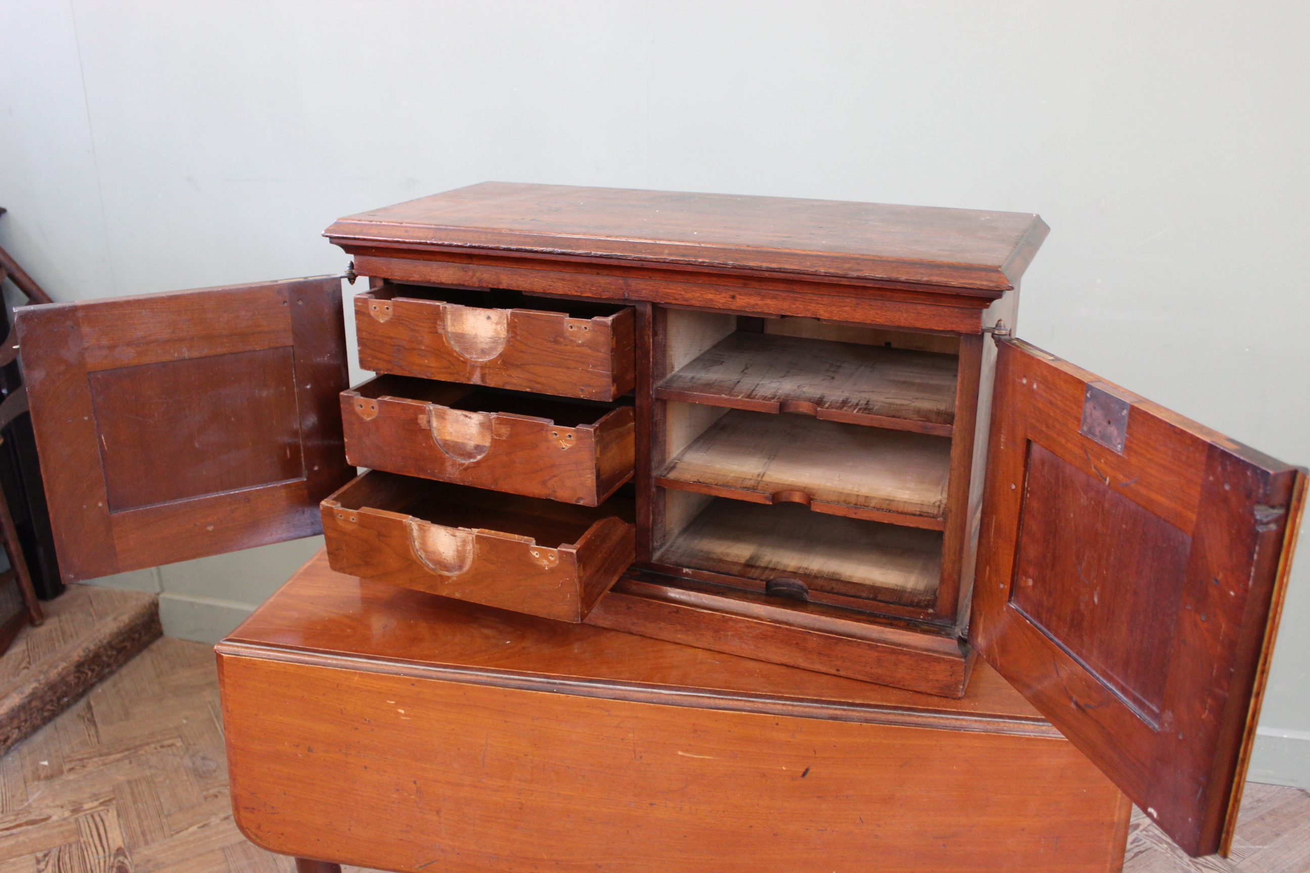 A late 19th Century mahogany two door desk top cabinet with shelved interior with three drawers, - Image 2 of 3